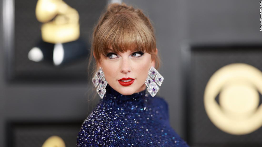 Swift channels her recent album &quot;Midnights&quot; with a shimmering blue ensemble. 