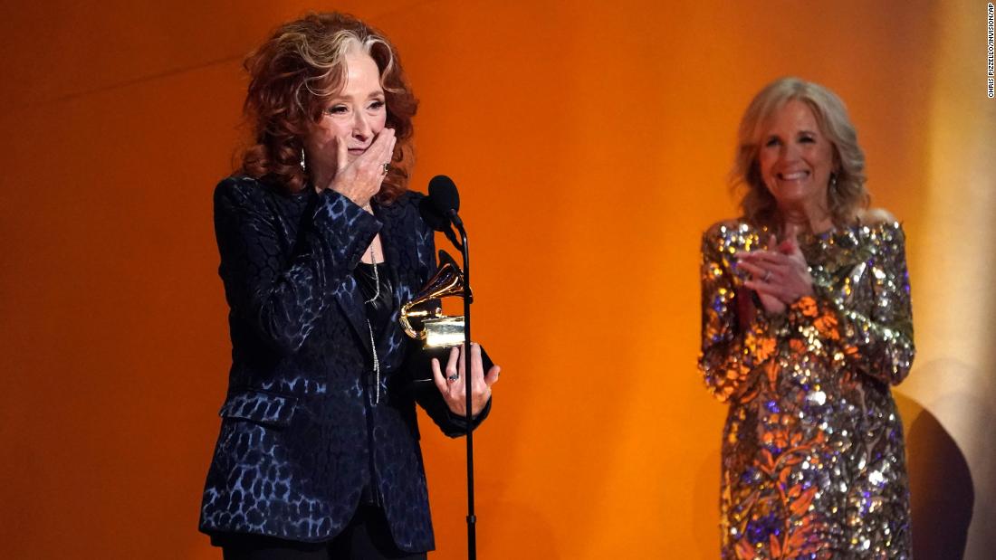A surprised Bonnie Raitt &lt;a href=&quot;https://www.cnn.com/entertainment/live-news/grammy-awards-2023/h_1ad0e0cc75898271bf691e7e530a4dc5&quot; target=&quot;_blank&quot;&gt;accepts the Grammy for song of the year&lt;/a&gt; as she is applauded by first lady Jill Biden, who presented the award.