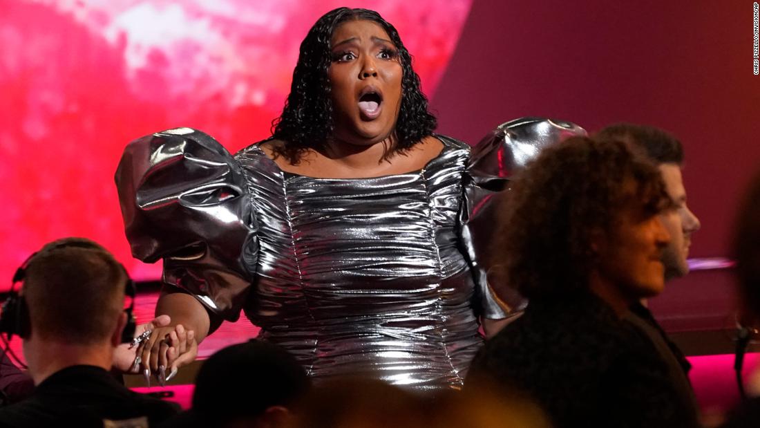 Lizzo reacts after &quot;About Damn Time&quot; &lt;a href=&quot;https://www.cnn.com/entertainment/live-news/grammy-awards-2023/h_3e32bffe8dfcbb101f092feeb7b438e4&quot; target=&quot;_blank&quot;&gt;won the Grammy for record of the year&lt;/a&gt;.