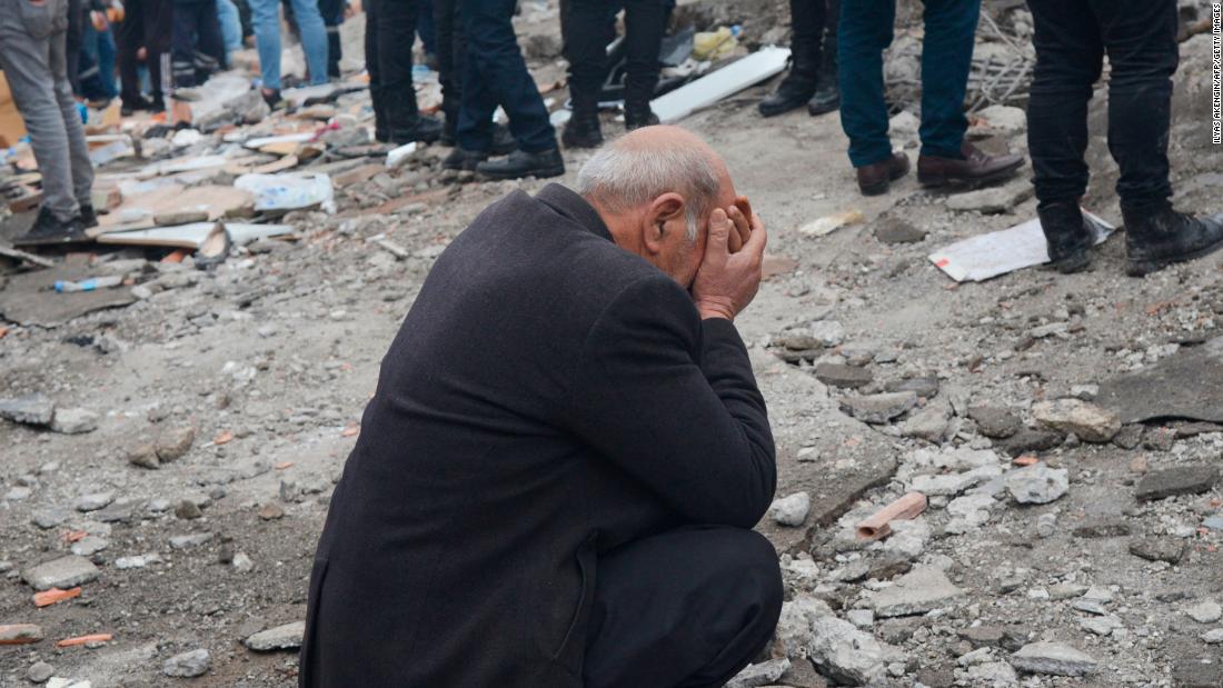 A man reacts as people search for survivors in Diyarbakir.