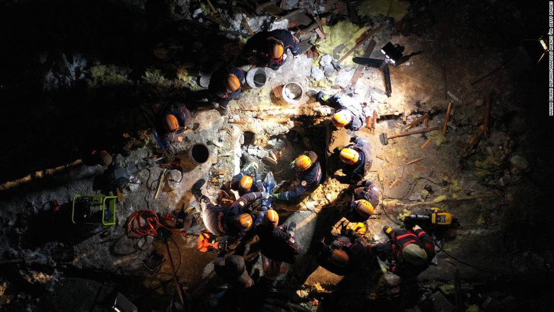 Search-and-rescue personnel work at a collapsed building in Malatya on February 6.