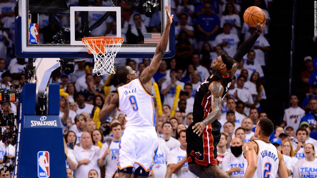 James dunks over Serge Ibaka during Game 2 of the Finals in June 2012. The Heat went on to win in five games, giving James his first NBA title.