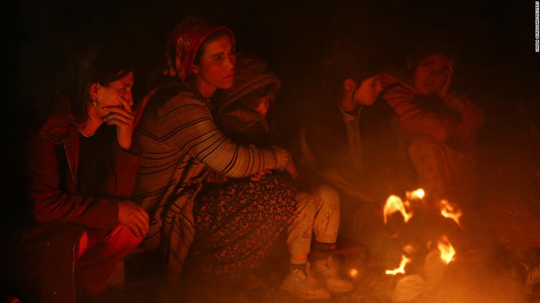 People gather around a bonfire in Kahramanmaras.