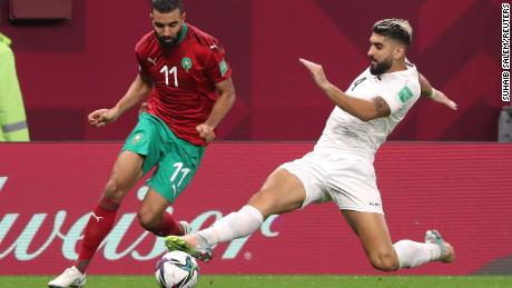Morocco&#39;s Ismail El Haddad and Palestinian Yaser Hamed contest the ball in an Arab Cup game in December 2021.