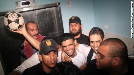 Palestinian football player Mahmoud Sarsak, who staged a hunger strike of nearly three months while in Israeli jail, is surrounded by relatives and supporters at the Al-Shifa hospital in Gaza City on July 10, 2012 upon his release from prison.