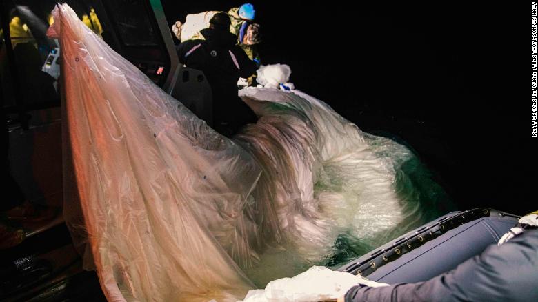 US Navy sailors collect the balloon off the coast of South Carolina on Sunday.