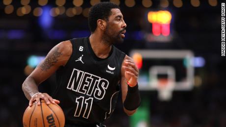 Kyrie Irving dribbles the ball while he plays for the Brooklyn Nets against the Boston Celtics on February 1 in Boston, Massachusetts.