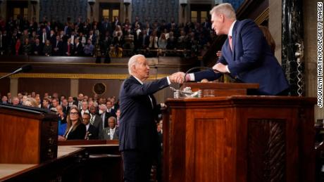 President Joe Biden shakes hands with Speaker of the House Kevin McCarthy as he arrives.