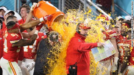 Kansas City Chiefs head coach Andy Reid is dunked with Gatorade by his players Jordan Lucas (24) and Cameron Erving (75) in the fourth quarter against the San Francisco 49ers in Super Bowl LIV at the Hard Rock Stadium on February 2, 2020, Miami Gardens, Florida.
