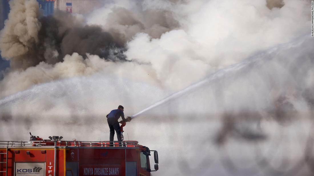 A firefighter works at the Turkish port of Iskenderun, where a fire broke out in the aftermath of the quake.
