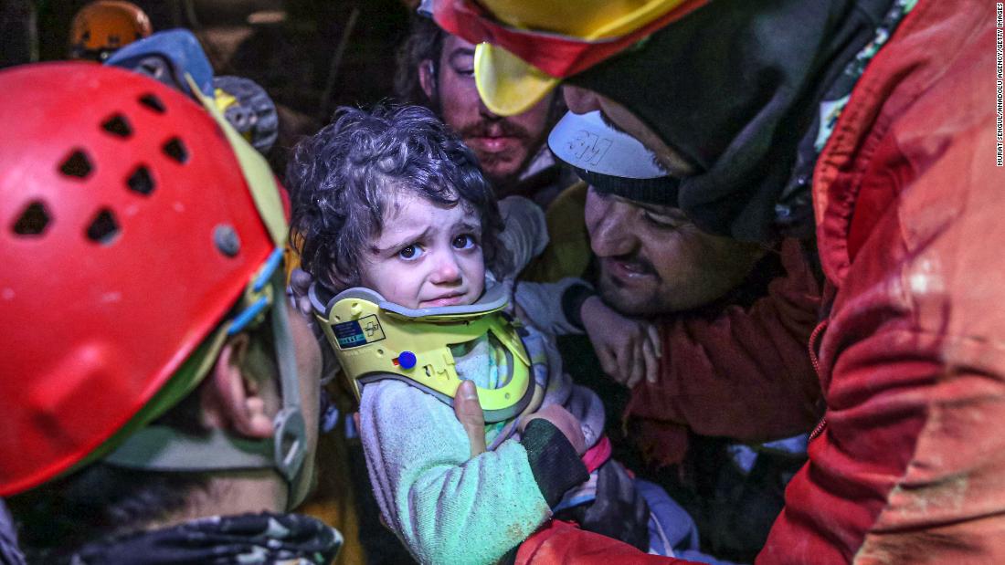 Search-and-rescue teams carry 2-year-old Vafe Sabha, who was pulled from rubble along with her mother in Hatay on February 8.