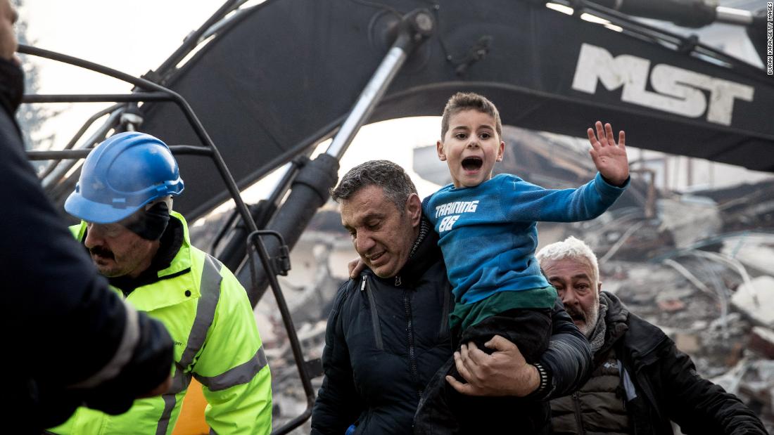Rescue workers carry &lt;a href=&quot;https://www.cnn.com/middleeast/live-news/turkey-syria-earthquake-updates-2-8-23-intl/h_bd774ec75c5663ab848e61d684bc914c&quot; target=&quot;_blank&quot;&gt;8-year-old survivor&lt;/a&gt; Yigit Cakmak from the site of a collapsed building in Hatay on February 8. It was more than 50 hours after the earthquake struck. The boy was passed from rescuer to rescuer until he was finally in the arms of his mother who was waiting at the site.