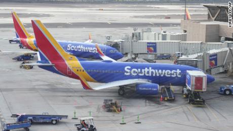 Southwest Airlines planes parked at Gates D4 and D6 in Terminal 4 of the Sky Harbor International Airport, Friday, Dec. 30, 2022, in Phoenix. (Kirby Lee via AP)