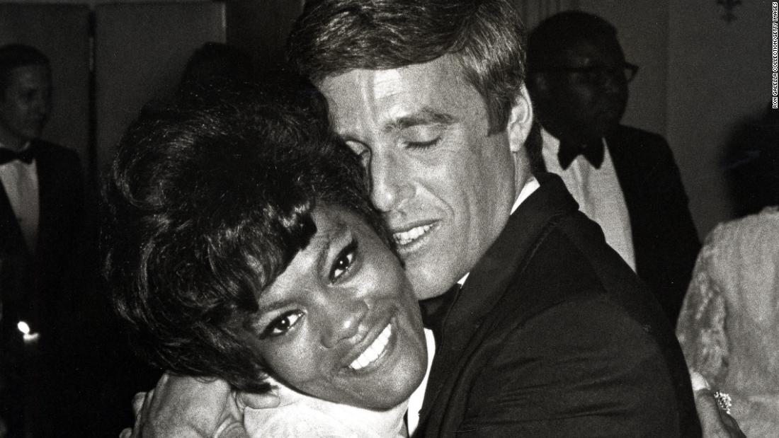 Bacharach hugs Warwick at a hotel in New York in 1968.