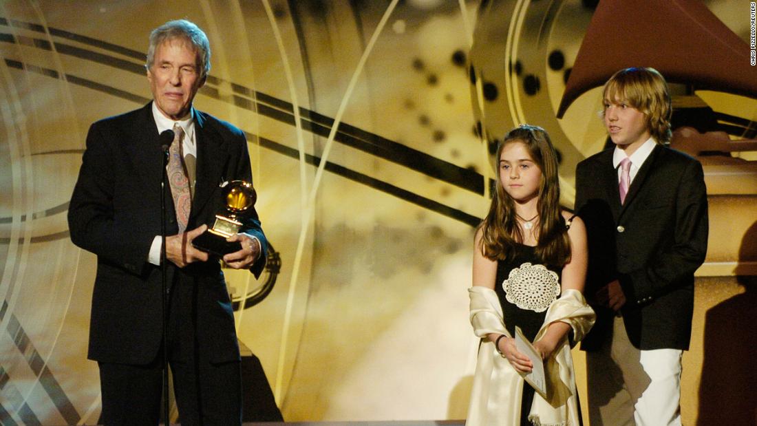 Bacharach stands on stage with his children Raleigh and Oliver after winning a Grammy for best pop instrumental album in 2006.