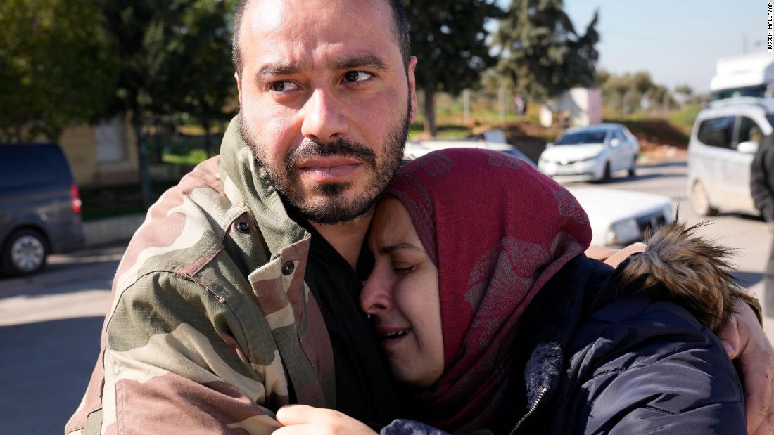 A couple mourns the loss of their daughter as her body is transferred to Syria from the Turkish crossing point of Cilvegozu on February 9.