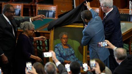 Opal Lee, second from left, who worked to help make Juneteenth a federally-recognized holiday, reacts as her portrait is unveiled in the Texas Senate chamber on February 8, 2023, in Austin, Texas.