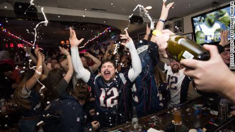 New England Patriots fans cheer after the Patriots beat the Los Angeles Rams in Super Bowl LIII at McGreevy&#39;s Bar in Boston, Massachusetts on February 3, 2019.