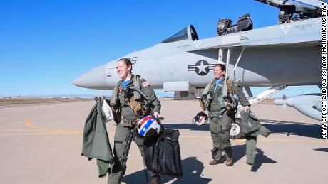 Lt. Lyndsey Evans and Lt. Margaret Dente exit an EA-18G Growler after arriving at Luke Air Force Base, Arizona on February 7, 2023, in preparation for their flyover of Super Bowl LVII at State Farm Stadium.