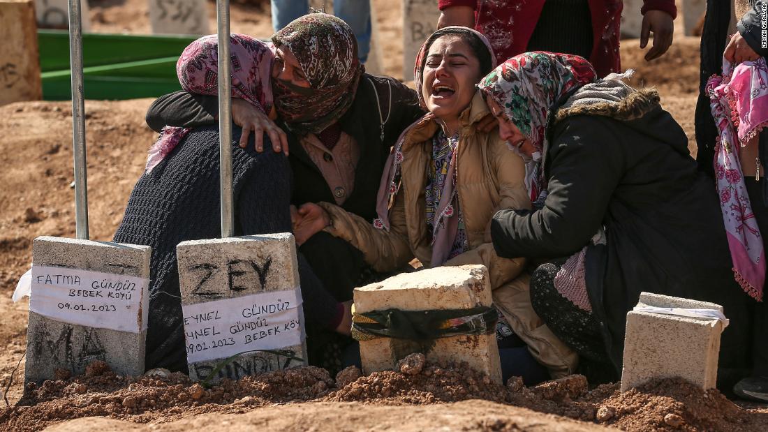 People mourn their loved ones as earthquake victims are buried in Adiyaman on February 10.