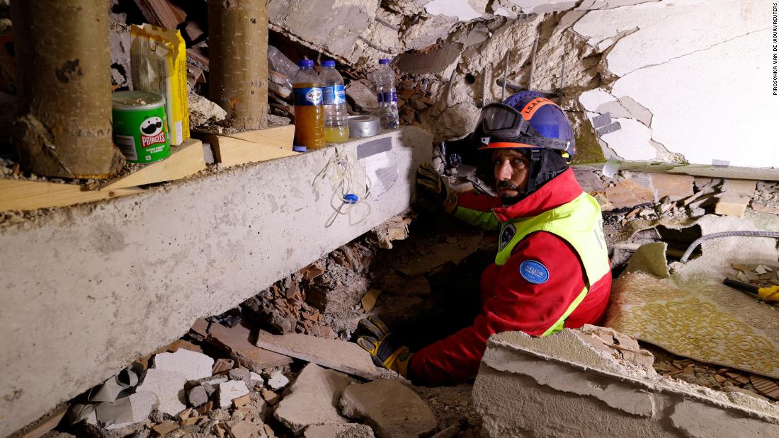 A rescuer shows a hole where he was speaking to Kahraman while she was still under the debris on February 9.