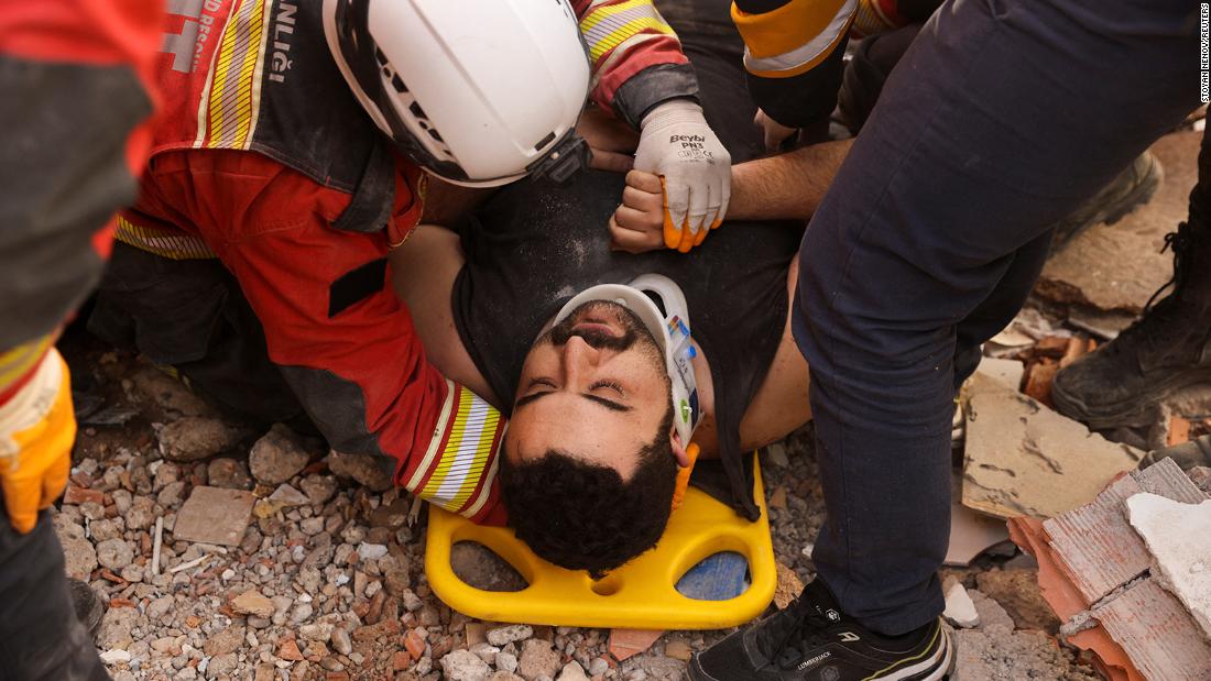 A man lies on a stretcher after he was rescued in Kahramanmaras on February 10.