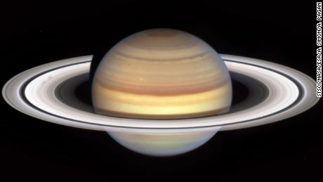 An image captured by NASA&#39;s Hubble Space Telescope&#39;s marks the start of Saturn&#39;s &quot;spoke season,&quot; with the appearance of two smudgy spokes (at left) in the B ring.
