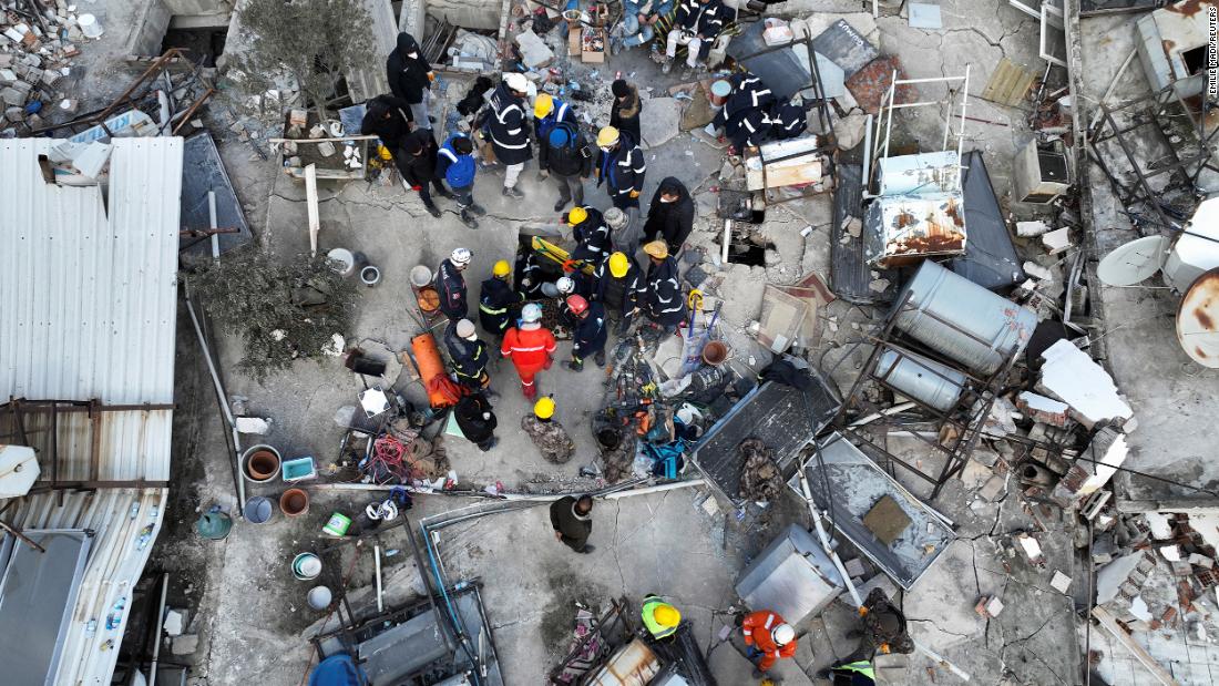 Rescuers try to free a child trapped under rubble in Hatay on February 10.