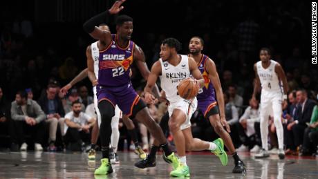 Thomas drives against Deandre Ayton of the Phoenix Suns at Barclays Center on February 07, 2023.