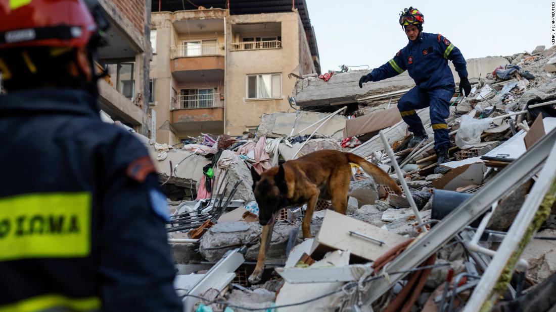 Members of a Greek rescue team work at the site of a collapsed building in Hatay on February 11. 