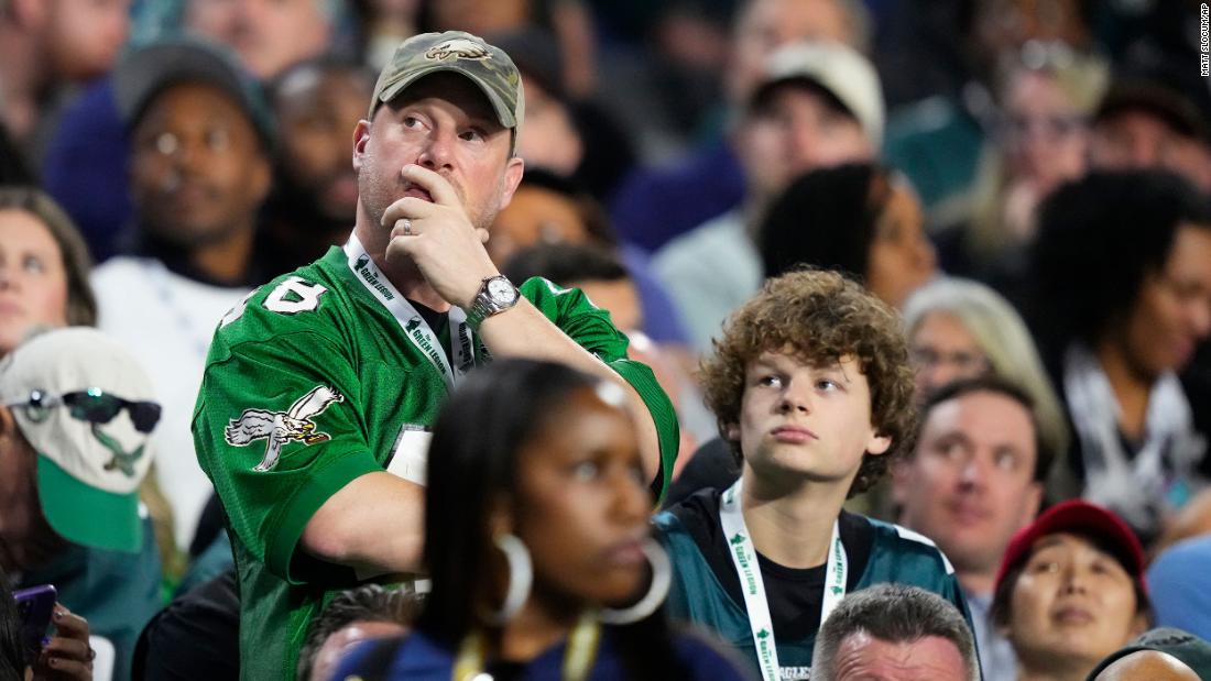 An Eagles fan watches the game in the second half.