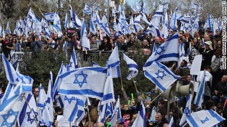 Thousands protest Netanyahu&#39;s plan to weaken Israel&#39;s judiciary as president warns of &#39;social collapse&#39;  