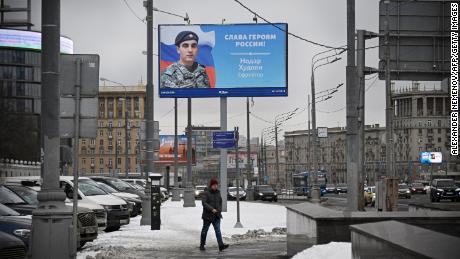 A billboard displays the face of Specialist Nodar Khydoyan, who is participating in Russia&#39;s military action in Ukraine, in central Moscow on February 15, 2023. 