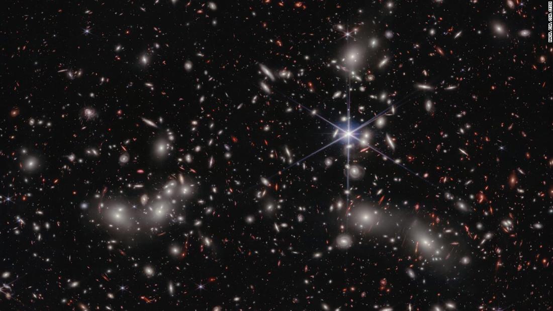 The James Webb Space Telescope captured 50,000 sources of near-infrared light in a new image of Pandora&#39;s Cluster, a megacluster of galaxies. The cluster acts like a magnifying glass, allowing astronomers to see more distant galaxies behind it.