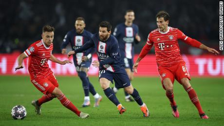 Lionel Messi tries to dribble past Joshua Kimmich (left) in PSG&#39;s defeat against Bayern Munich. 