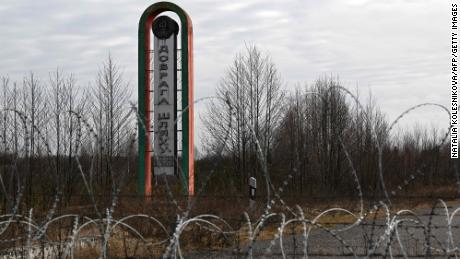 A sign reads &quot;Bon Voyage&quot; at the Divin border crossing point between Belarus and Ukraine on February 15, 2023.