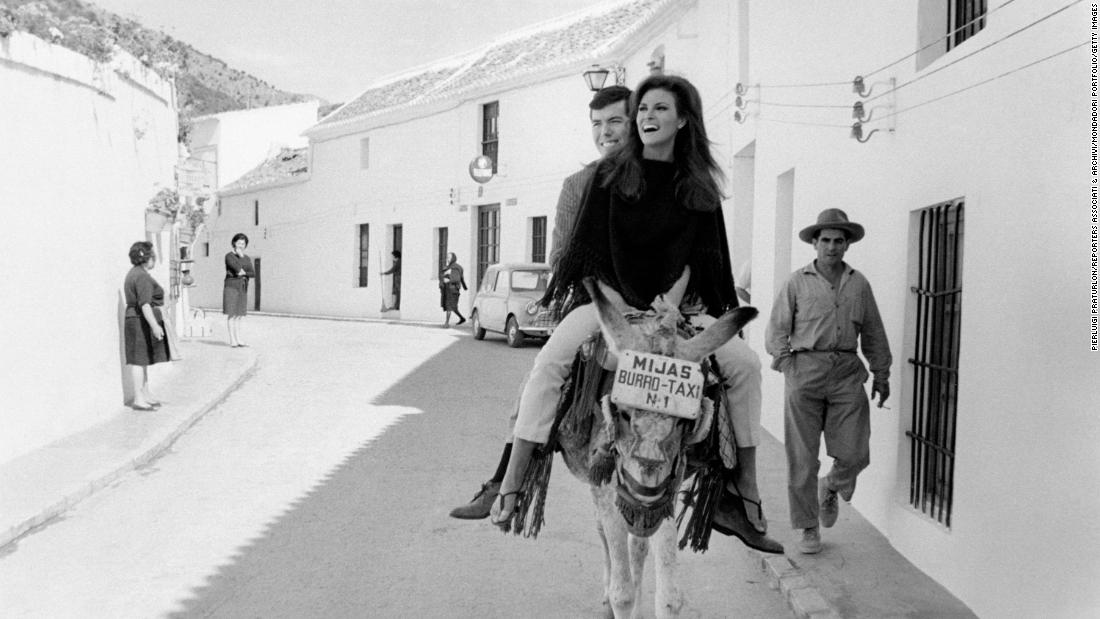Welch rides a donkey in Malaga, Spain, with her boyfriend, film producer Patrick Curtis, in 1966. She was in Spain shooting the movie &quot;Fathom.&quot; Welch and Curtis married the next year. Curtis was the second of Welch&#39;s four husbands.