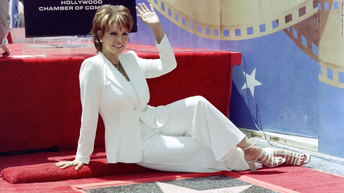 Welch waves as she receives a star on the Hollywood Walk of Fame in 1996.