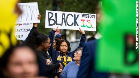 Hundreds participate in the National Action Network demonstration on February 15 in response to Florida Gov. Ron DeSantis&#39; rejection of an AP African American studies course.