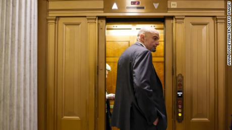 Democratic Sen. John Fetterman of Pennsylvania departs from the Senate Chambers during a series of the votes at the U.S. Capitol Building on February 13, 2023 in Washington, DC.