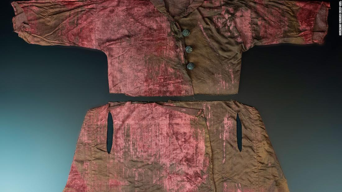 A velvet robe made with expensive red dye was found in the same chest as the gowns.