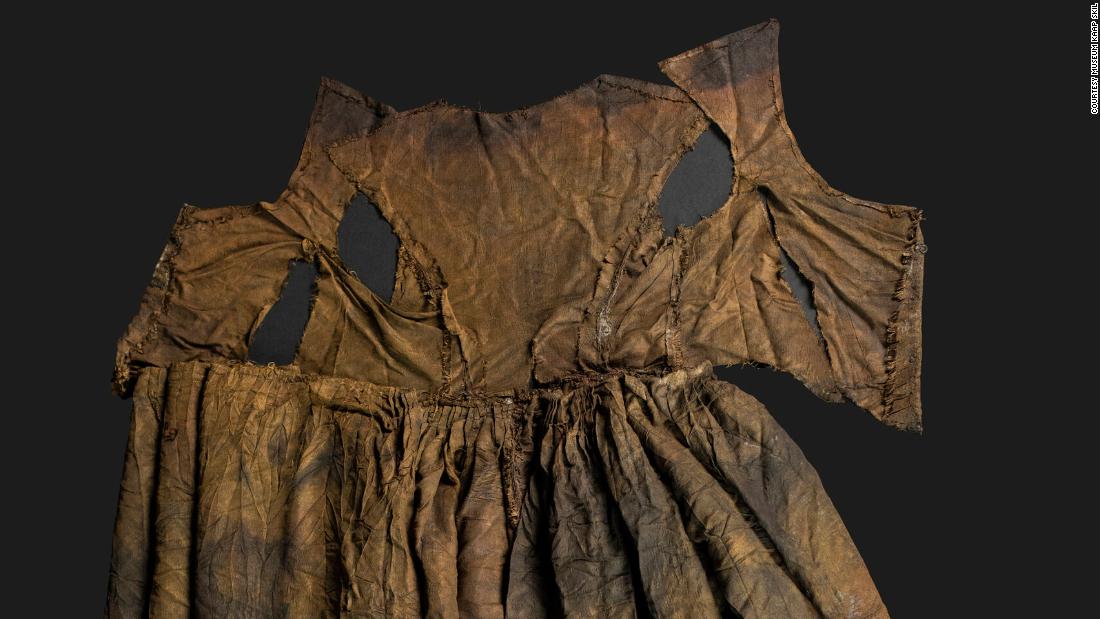 A silk wedding dress interwoven with pieces of silver was recovered from the same chest as the other silk dress. The two dresses are different sizes, suggesting the clothing belonged to a family rather than one person.