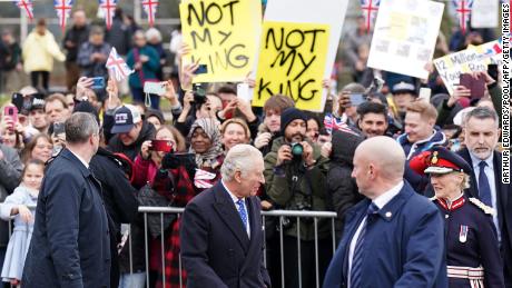 Demonstrators hold placards reading &quot;Not My King&quot; as King Charles III meets well-wishers in Milton Keynes, north of London, Thursday. 