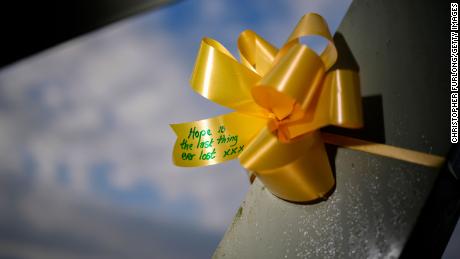  Yellow ribbons and heart shaped paper notes adorned with messages of hope and goodwill are tied to the footbridge in the village of St Michael&#39;s on Wyre.