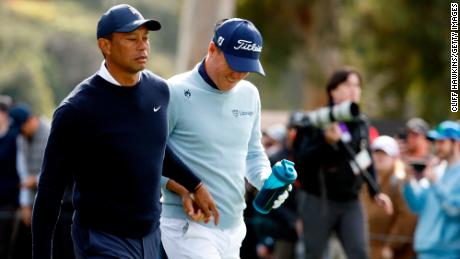 PACIFIC PALISADES, CALIFORNIA - FEBRUARY 16: Tiger Woods of the United States (L) and Justin Thomas of the United States walk off the ninth tee during the first round of the The Genesis Invitational at Riviera Country Club on February 16, 2023 in Pacific Palisades, California. (Photo by Cliff Hawkins/Getty Images)