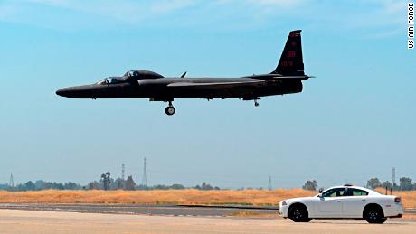 A mobile chase car pursues a U-2 Dragon Lady as it prepares to land at Beale Air Force Base in California in June 2015.