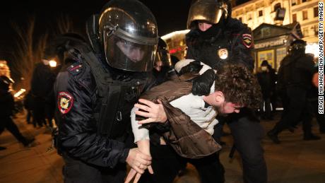 Police officers detain a demonstrator during a protest against Russia&#39;s invasion of Ukraine in St. Petersburg on February 27, 2022.