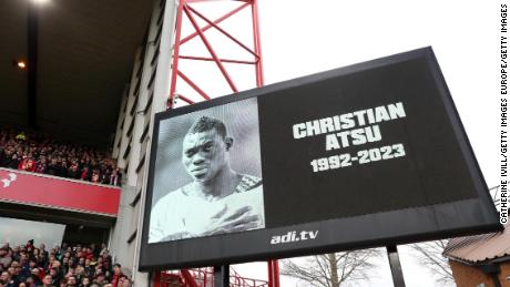 An image of former Premier League player Christian Atsu, is shown on the screen as a minutes silence is observed in his memory prior to a match between Nottingham Forest and Manchester City on February 18, 2023 in Nottingham, England.