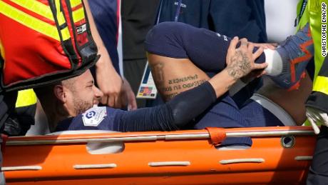 PSG&#39;s Neymar is carried off the field on a stretcher against Lille. 