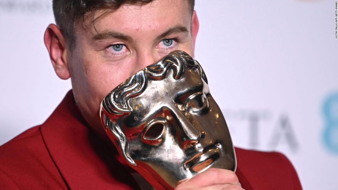 Barry Keoghan poses with his best supporting actor award.